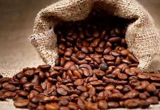 Coffee beans pouring out a bag