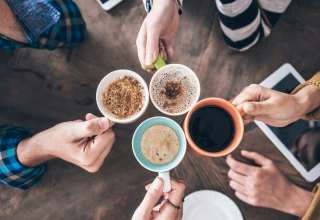 A group of friends enjoying different types of coffee