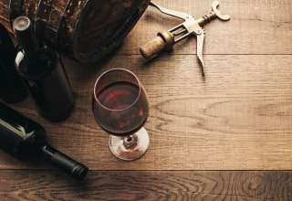 Wine glasses, corkscrew and barrel