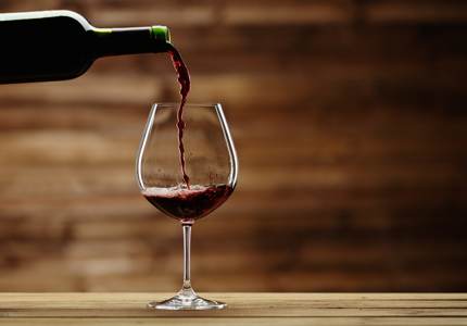 Red wine being poured into glass