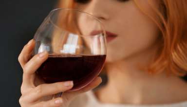Woman drinking a glass of wine
